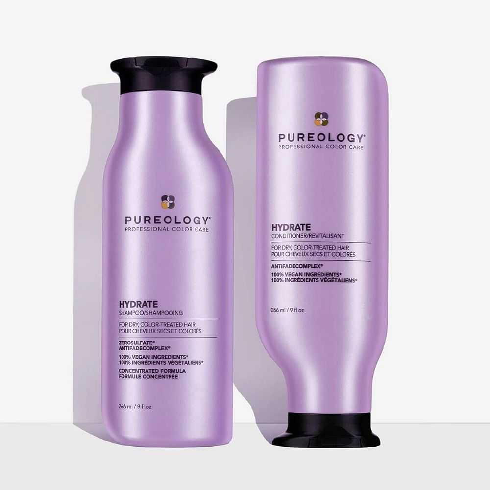 Two bottles of Pureology hair care products against a white background.