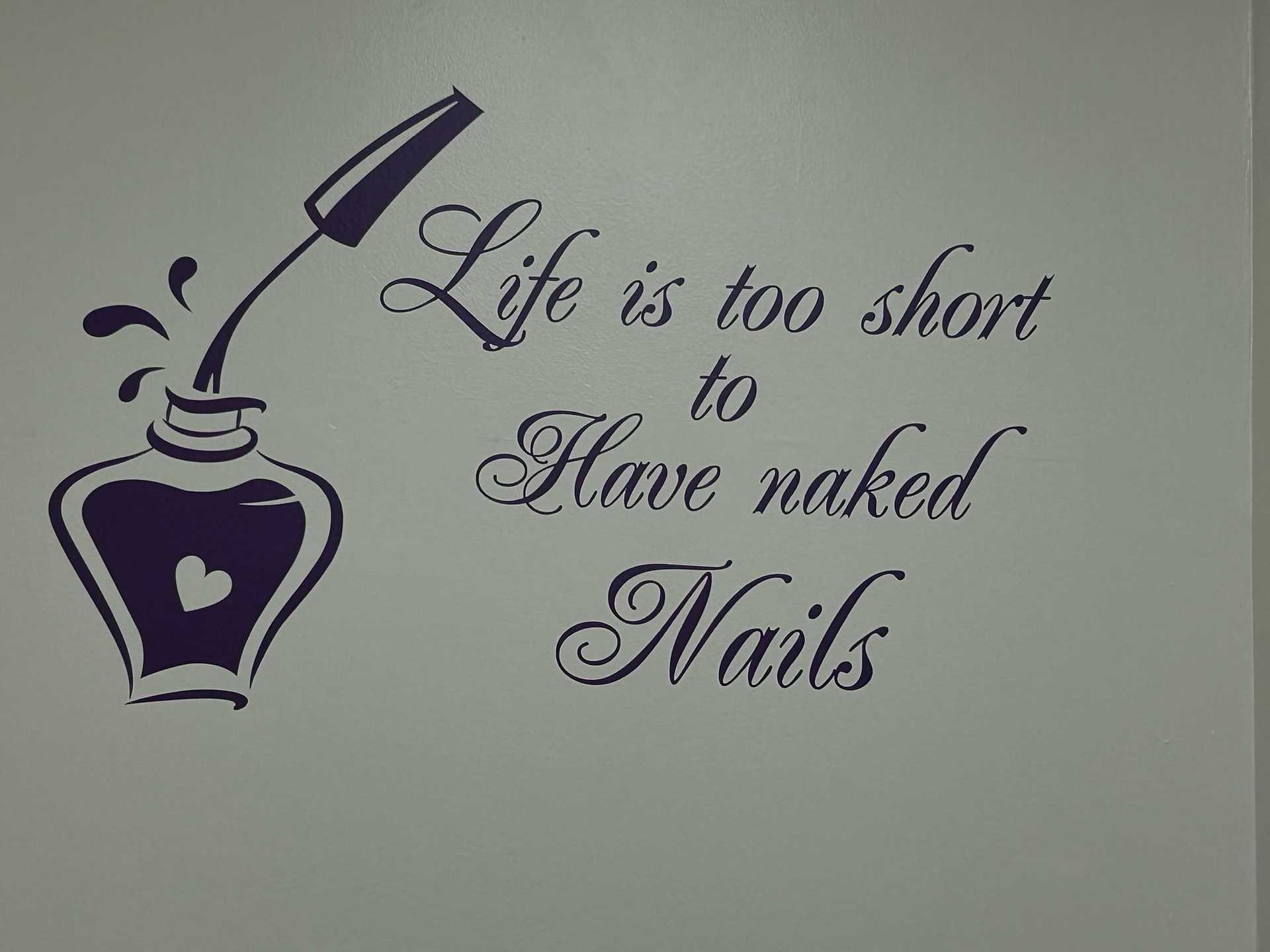 Wall art of an ink bottle with quote "Life is too short to have naked Nails.